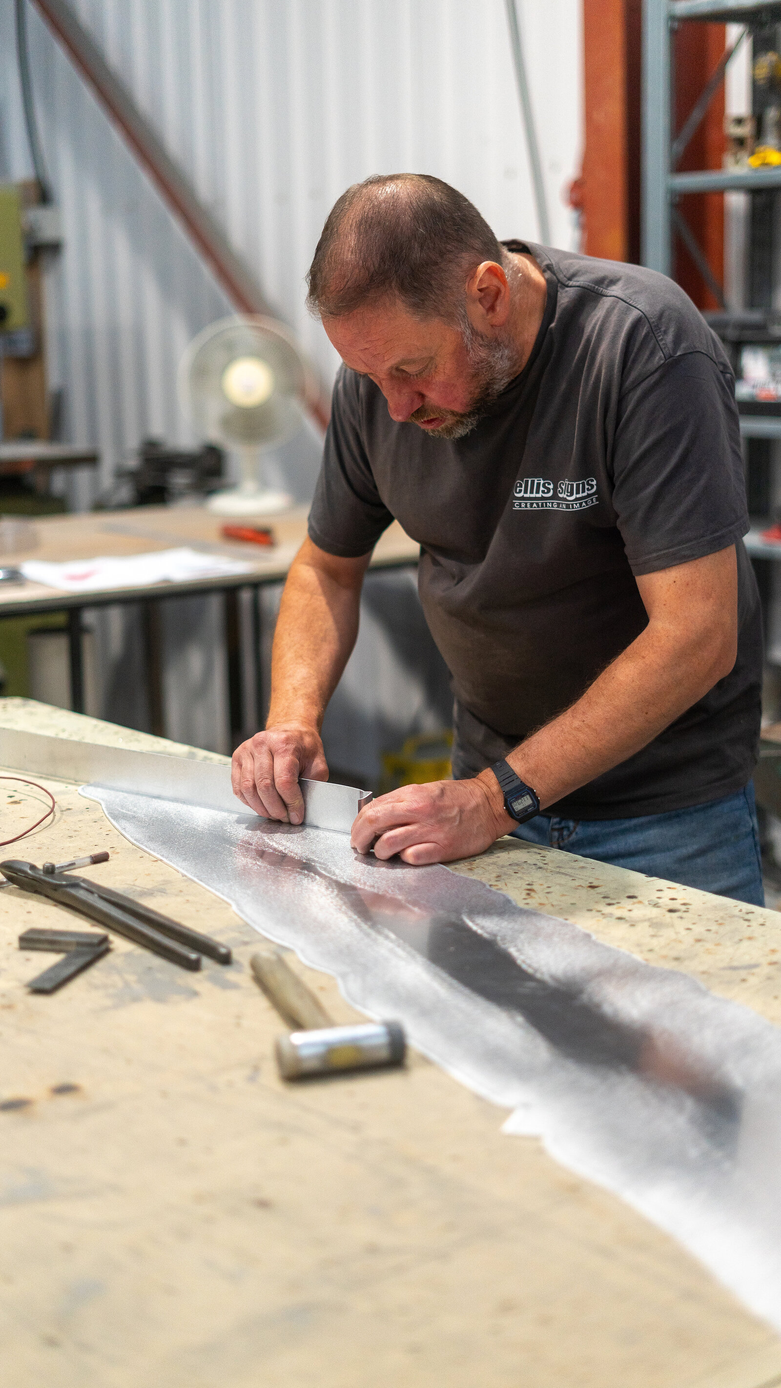 Sheet metal being cut in the Ellis Signs workshop (placeholder image pending authorised photography)